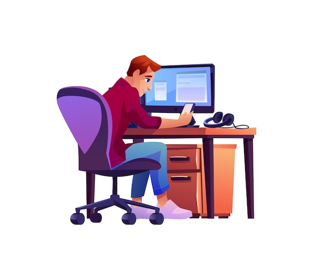 Man at workplace with computer on table and phone