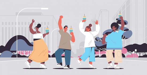 mix race people walking outdoor drinking coffee spending time without gadgets digital detox concept