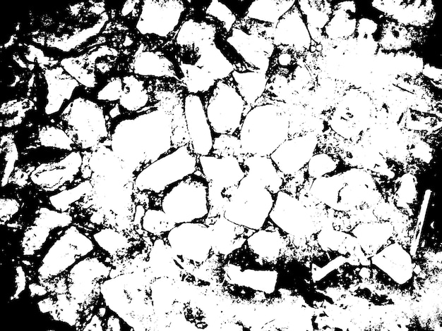 A black and white image of a road with stones in it.