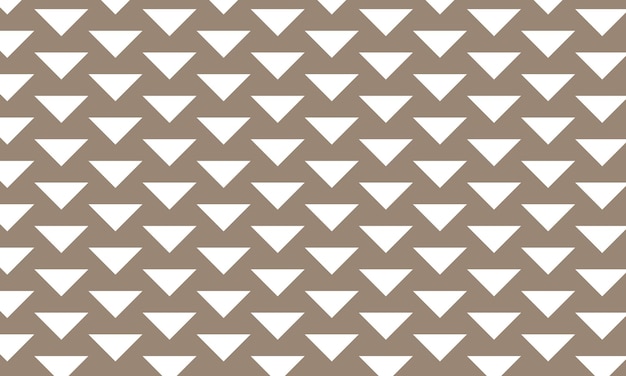 a pattern of white triangles on a brown background