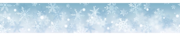 Christmas banner of complex blurred and clear snowflakes in white colors on light blue background With horizontal repetition