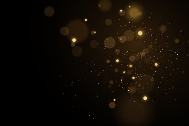 Lights bokeh on a black background. Glares with flying glowing particles. Ligh gold effect.