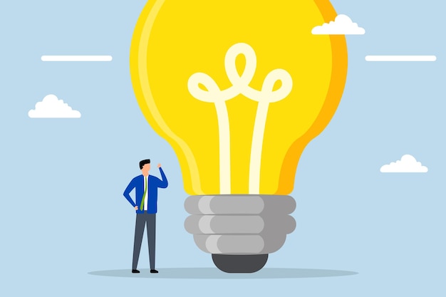 Think big businessman entrepreneur who thinks with big oversized idea bulb