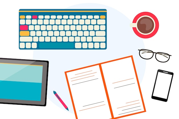 Top view of the workspace. Desktop with keyboard, tablet, book, phone, glasses and coffee mug.