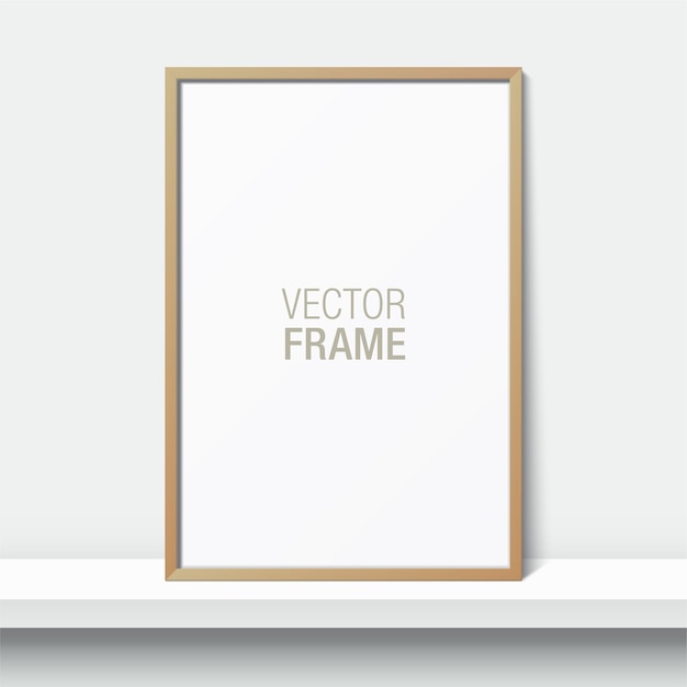 Wooden  frame standing on a shelf. Blank picture frame leaning against the white wall.