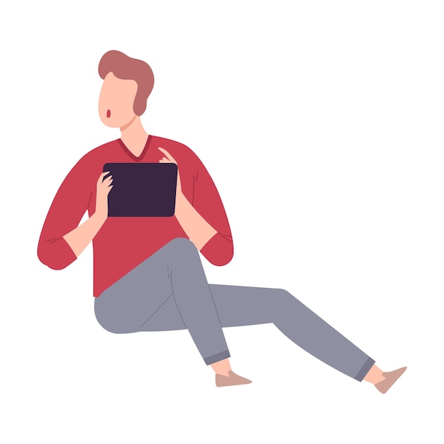 young man with modern digital gadget guy sitting on the floor and communicating using his tablet flat vector illustration