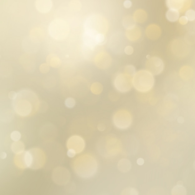 Abstrakcjonistycznego złotego błyskotliwości bokeh defocused tło.