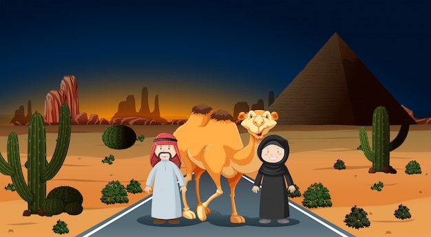 Arabska para z wielbłądem na pustyni