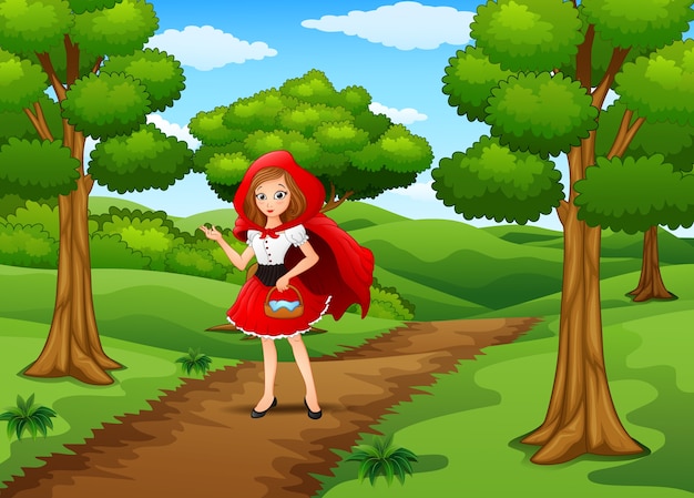 Plik wektorowy czerwona zakapturzona dziewczyna jest w wiosce przy lasem