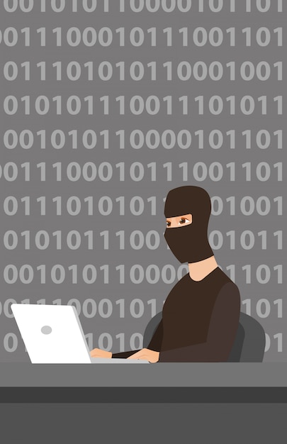 Haker używający laptopa do kradzieży informacji