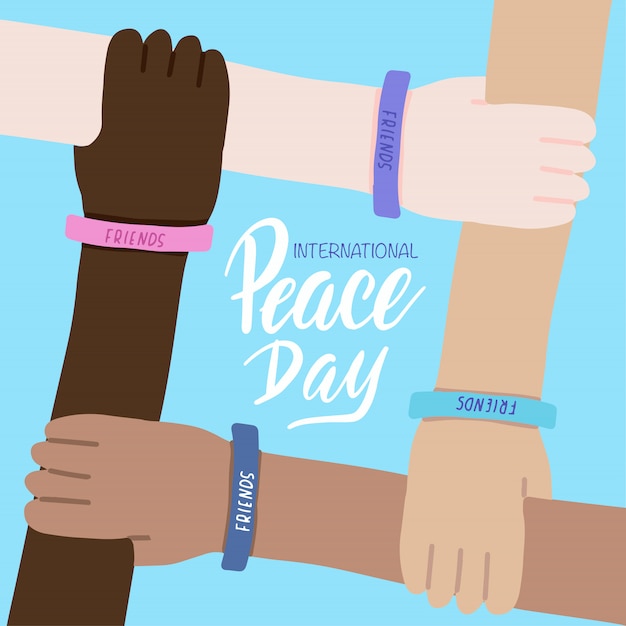 Plik wektorowy kartkę z życzeniami międzynarodowy dzień pokoju. cztery ręce ludzi różnych ras i skrzyżowane razem. światowa przyjaźń.