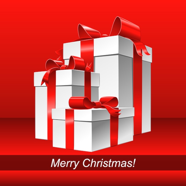 Kartkę z życzeniami Wesołych Świąt z białym pudełkiem i kokardą z czerwoną wstążką