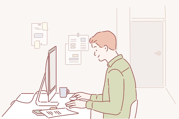 Mężczyzna siedzi przy biurku przed ekranem komputera z napisem „jestem programistą”