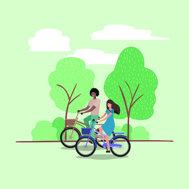 młoda para na rowerze w parku