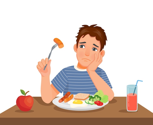 Młody Człowiek Nie Ma Apetytu Na Jedzenie, Siedząc Przed śniadaniem Przy Stole