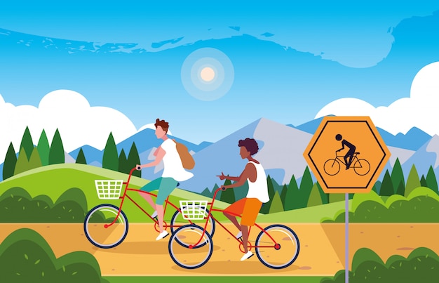 Plik wektorowy pary jeździecki rower w krajobrazie z signage dla cyklisty