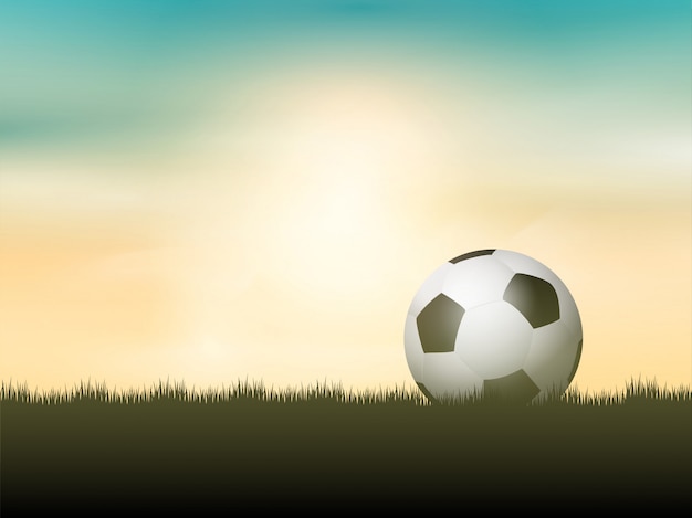 Plik wektorowy piłka nożna lub futbol położony w trawie