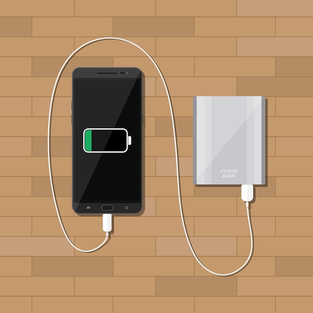 Powerbank ładuje Smartphone Na Drewnianym Biurku