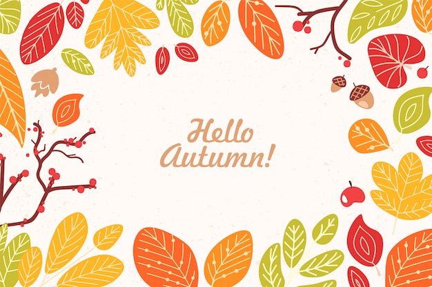 ramka lub obramowanie wykonane z opadłych suszonych liści, żołędzi, szyszek, jagód i frazy Hello Autumn napisane kursywą kaligraficzną czcionką.