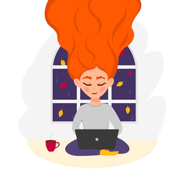 Ruda Kobieta Pije Herbatę Lub Kawę I Pracuje Na Laptopie Przy Oknie Z Jesiennymi Liśćmi