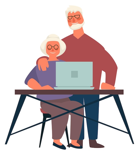 Seniorzy korzystający z laptopów nowoczesnych technologii