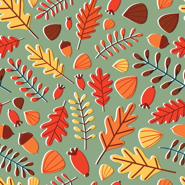 Sezonowy wzór z opadłych liści jesienią, gałęzi, jagód i żołędzi na zielonym tle.