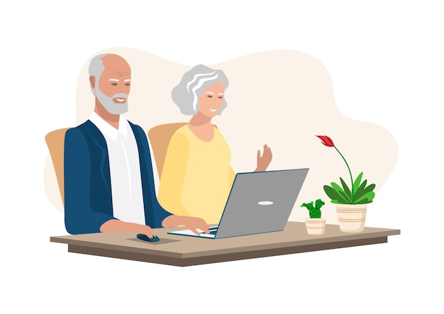 Starsza para używająca laptopa