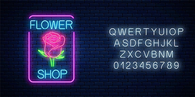 Świecący Neonowy Znak Kwiaciarni W Prostokątnej Ramce Z Alfabetem Na Ciemnym Murem