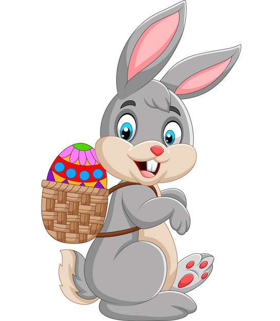 Wielkanocnego królika przewożenia kosz Easter jajko