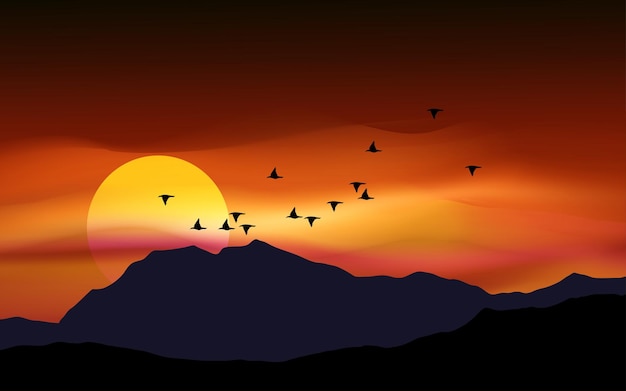 Zachód słońca nad górą i wzgórzem Zachód słońca nad górą z ptakami