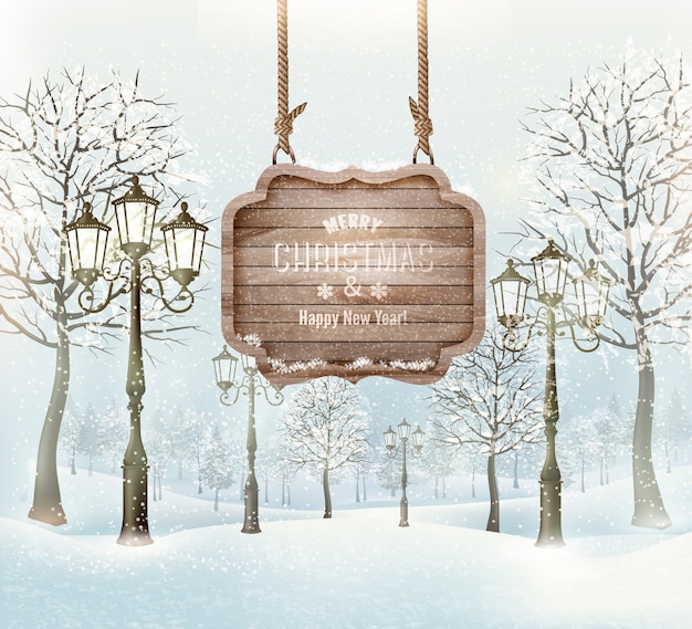 Plik wektorowy zimowy krajobraz z latarniami i drewnianym ozdobnym znakiem wesołych świąt.
