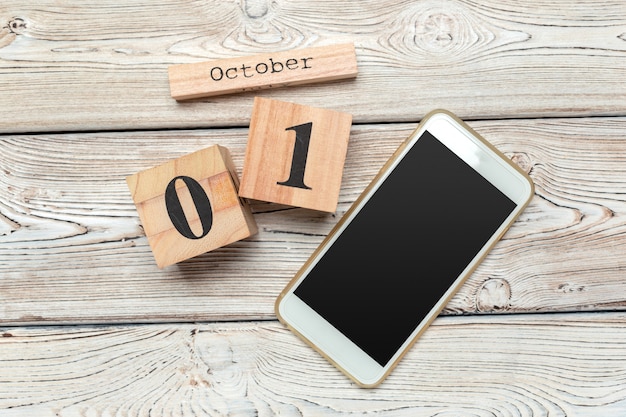 1 października. 1 października biały drewniany kalendarz na drewnie
