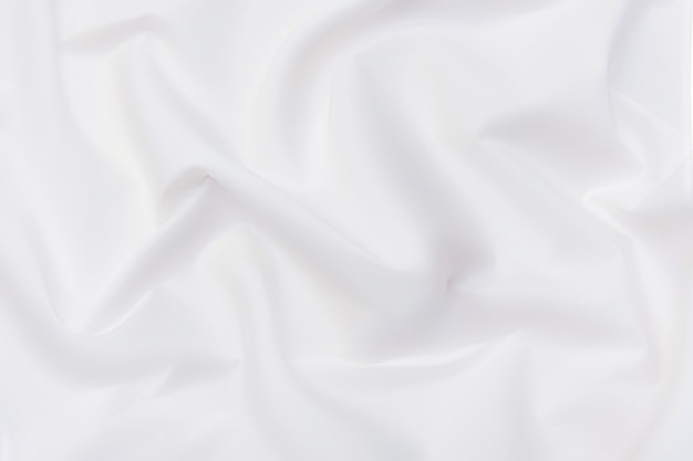 Abstrakcyjna i miękka fala tła tkaniny w kolorze białym lub kości słoniowej, białej tekstury i szczegółów