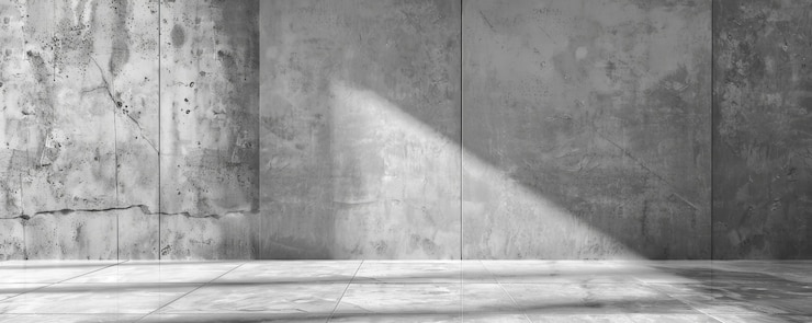 Zdjęcie abstrakcyjna pusta szara betonowa ściana z promieniem słońca przez nowoczesne tło architektoniczne