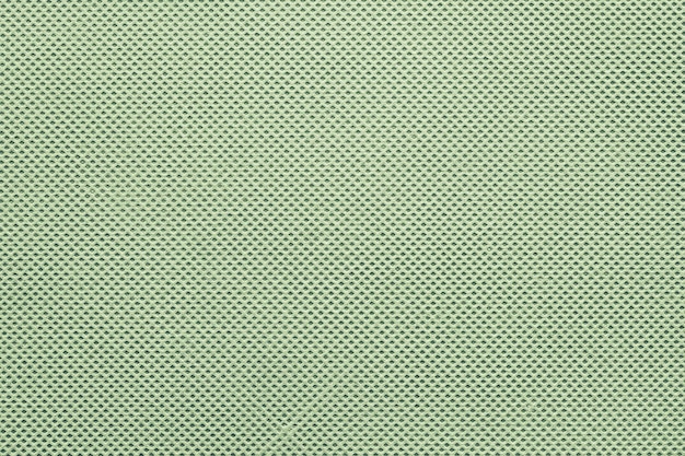 Abstrakcyjna tekstura nadrukowanej siatki dla tła w kolorze zielonym