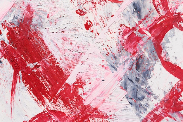 Zdjęcie abstrakcyjne czerwone tło chaotyczne pociągnięcia pędzla i plamy farby na białym papierze jasne kontrastowe tło
