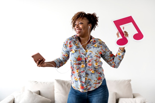 African American woman enjoying music