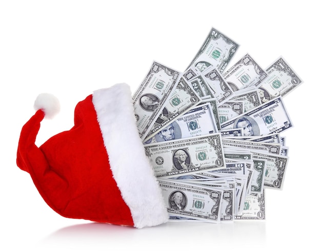 Banknoty dolarowe wychodzące z kapelusza Świętego Mikołaja na białym tle