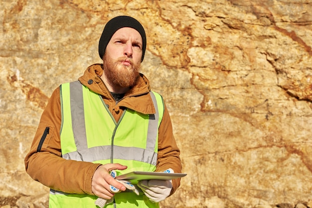 Bearded Gold Miner Inspecting Land