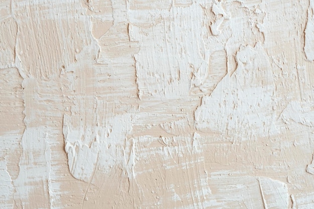 Beżowy dekoracyjny tynk betonowy teksturowany tło Dekoracyjna próbka kitu na ścianie