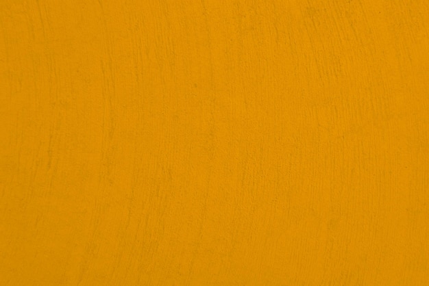 Bezszwowa tekstura żółtego cementu starej ściany szorstkiej powierzchni z miejscem na tekst na backgroundx9