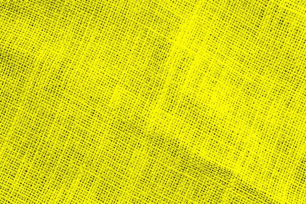 Bezszwowe grunge teksturowane żółte tło tkaniny worowej