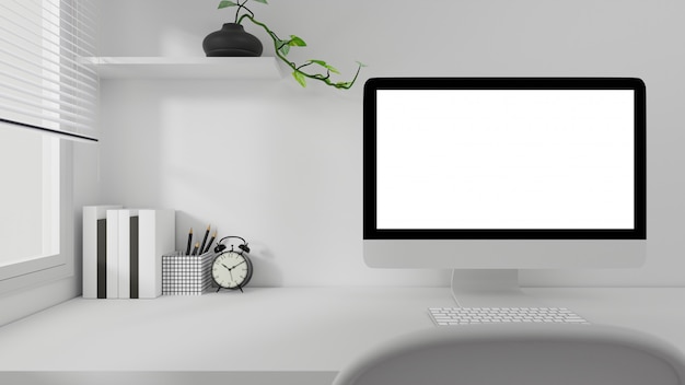 Zdjęcie białego ekranu komputerowy laptop na pracującym stołu domowym biurze.