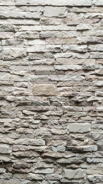 Biały kamienny mur tekstura tło wzór.