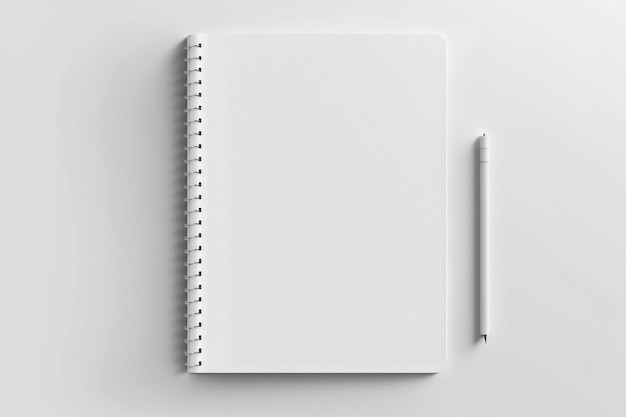 Biały notatnik z białym długopisem na białej powierzchni.