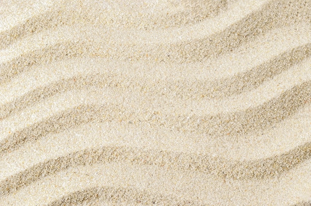 Biały piasek tekstury tło z falowym wzorem