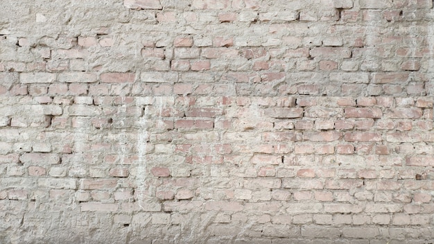 Biały stary mur z cegły. Ściana banerowa lub tekstura