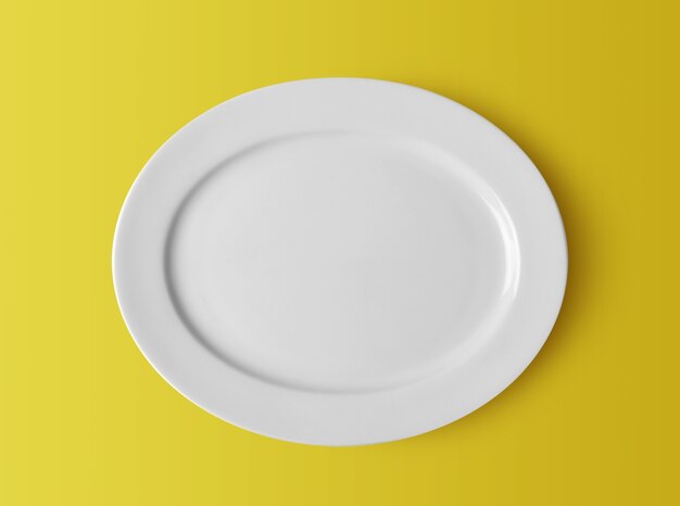 Biały talerz ceramiczny na żółtym tle