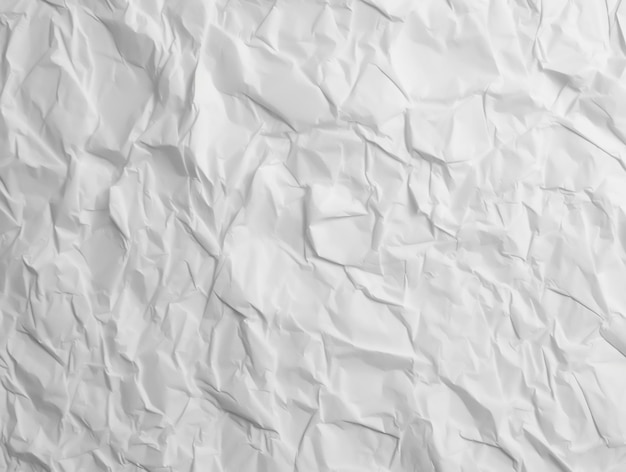Biały zmięty papier z napisem „papier”.