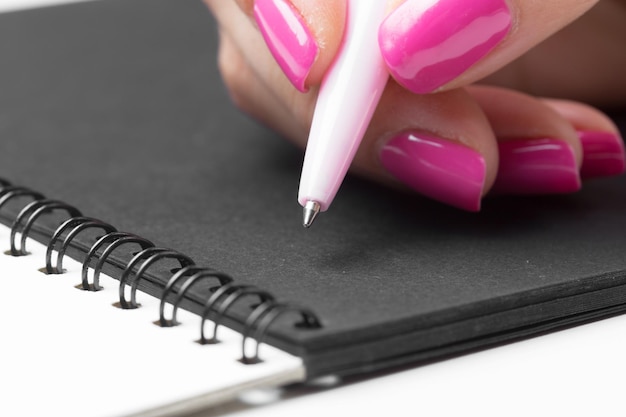 Biznes kobiety ręce pracujące w pisaniu zeszytu